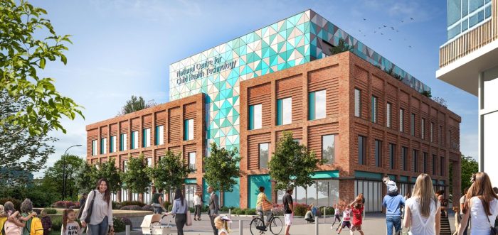 Modern healthcare building with people walking and cycling, surrounded by trees and blue sky, labelled 'National Centre